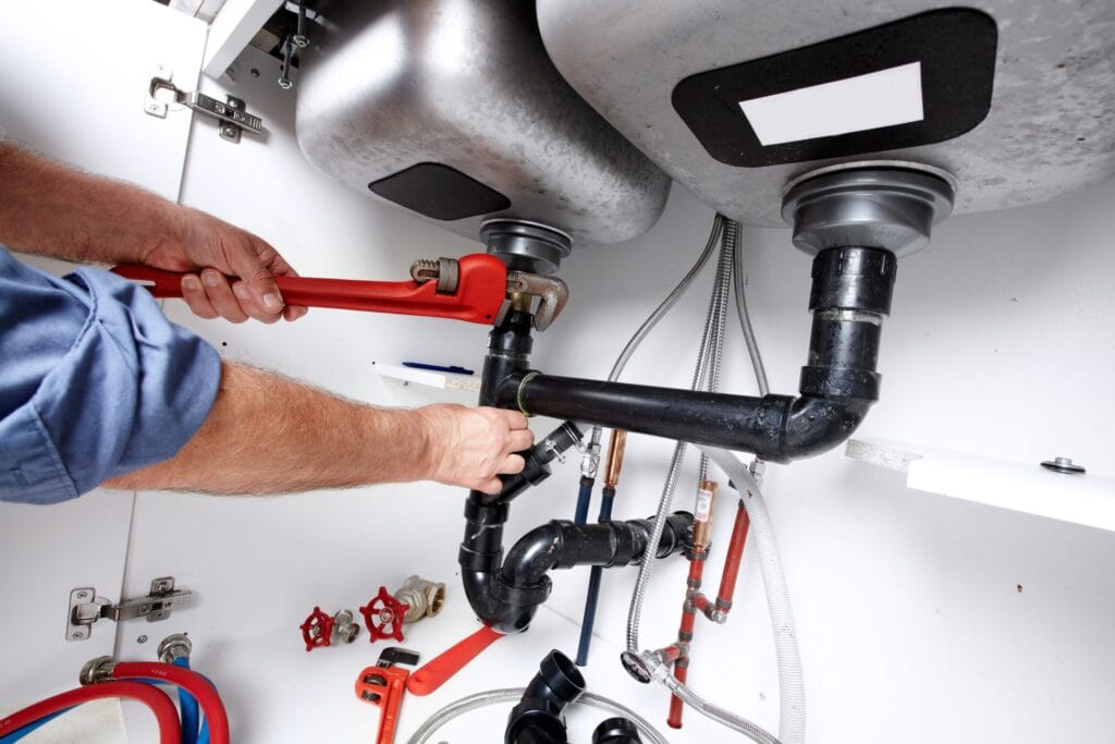 Danville Plumbing Pros fixing under sink plumbing and drain pipes