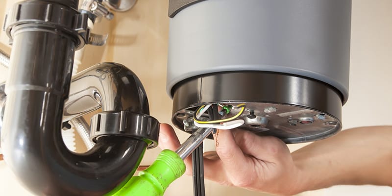 Danville, California plumber servicing water heater pipe connection